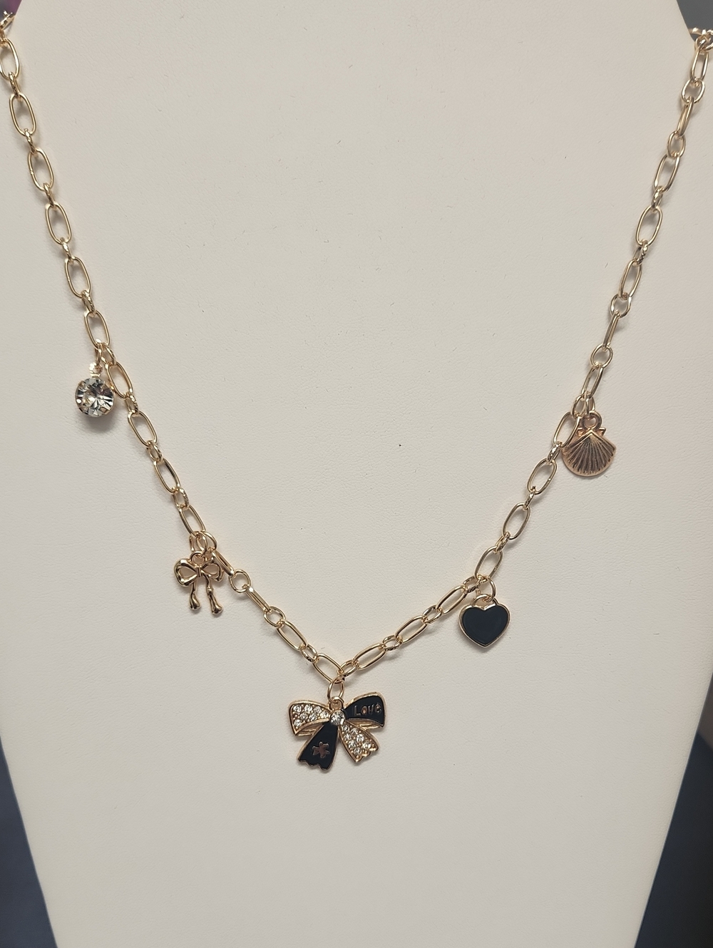 Gold-Tone Charm Necklace with Black Enamel Accents